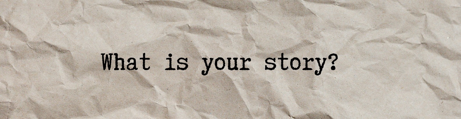 Text "what is your story?" written on paper